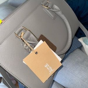 Brand new grey vegan leather miztique purse.